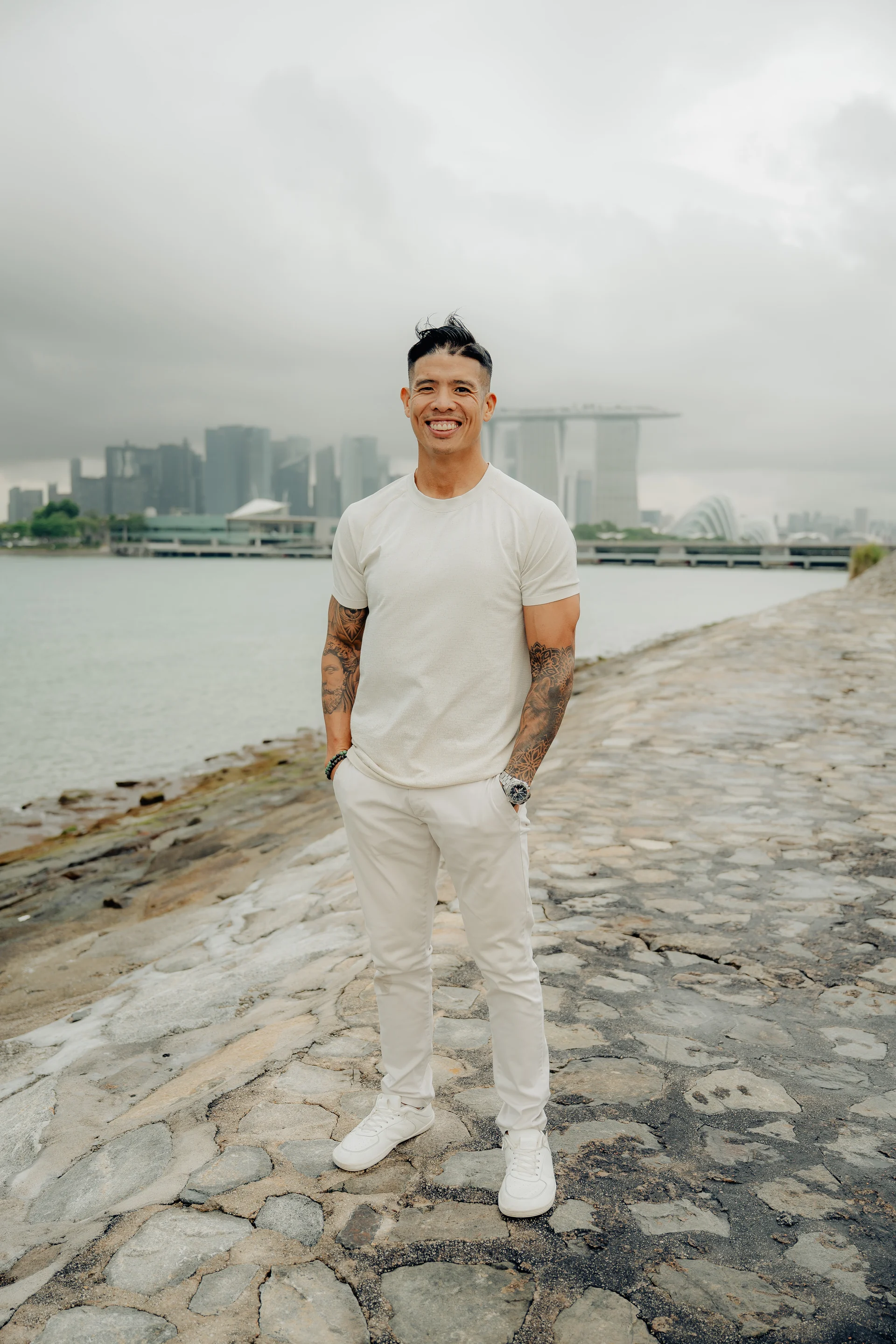 Luke Tan standing beside the water at Marina Bay